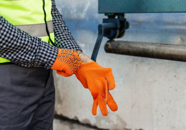commercial waterproofer putting protective gloves